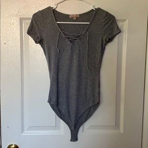 Dark, heather gray body suit